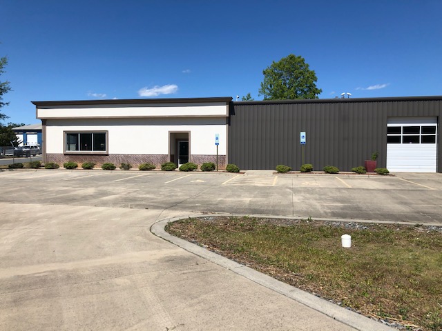 Modern commercial industrial building white facade